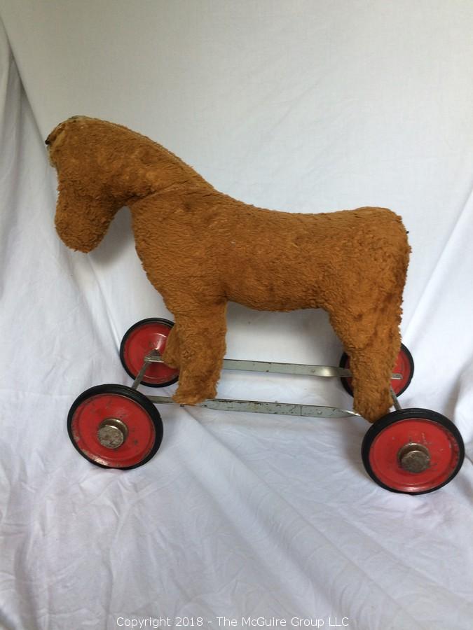 vintage toy horse on wheels